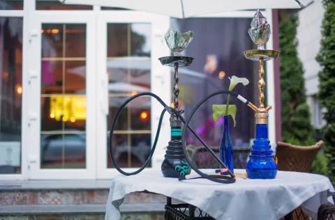 Close-up photo of two hookahs on table Foto stock