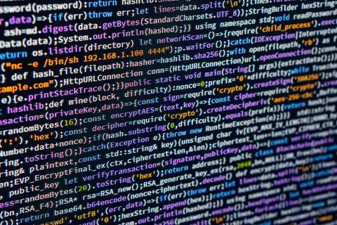Close-up photograph of a focused segment of C code with color-coded syntax .. Stock Photos