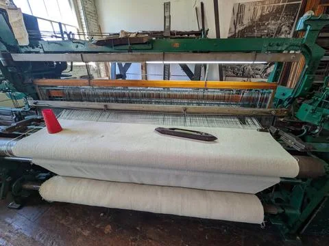 Close-up photograph of a large textile machine Stock Photos
