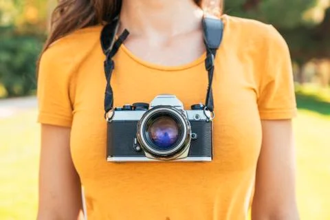 Close up of a photographer with her camera. Stock Photos