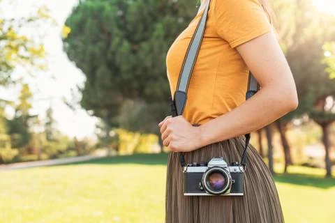 Close up of a photographer with her camera. Stock Photos