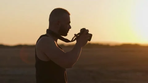 Close-up of photographer using digital camera and taking landscape photo Stock Footage 132166176