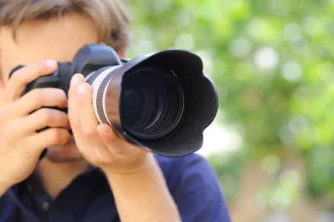 Close up of a photographer using a dslr camera Stock Photos