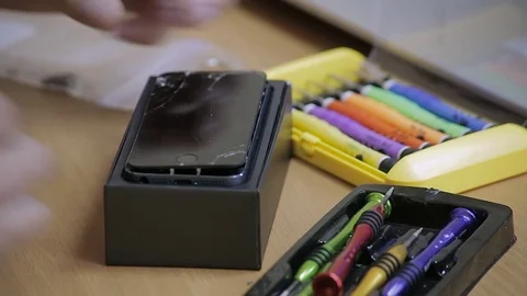 Close-up photos showing process of mobile phone repair, changing the screen Stockbeeldmateriaal 70139382