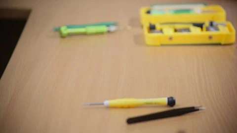 Close-up photos showing process of mobile phone repair, changing the screen Видео 70139413