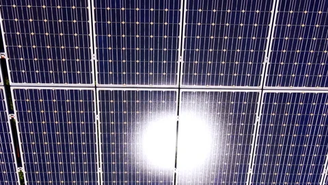Close up of photovoltaic module grid with intense sun flare, Bulgaria Stock Footage 336343973