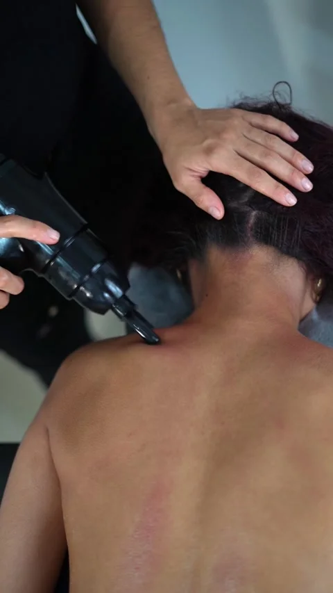 Close Up Of Physiotherapist Treating Lower Back Pain With Electronic Massage Dev Stock Footage 332658311