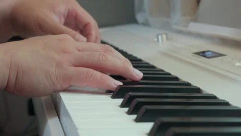 Close up of pianist hands playing classical music on white digital piano Video stock 337929808