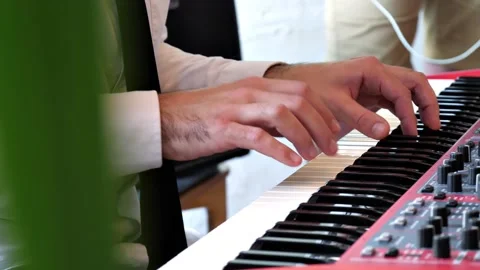  close-up of the pianist's hands performing his part of the song Stock Footage 204991422