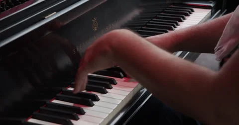 Close-up of pianist's hands playing a Steinway &amp; Sons grand piano in concert. Stock Footage 313998834