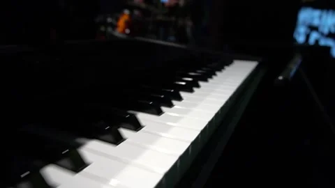 Close-up of piano keys moving right to left. Stock Footage 150422374