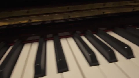 Close Up Piano Keys with Reflections and Flickering Light Stock Footage 345089586