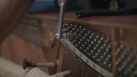 Close Up of Pianotuner Using a Tuning Lever 스톡 동영상 90458575