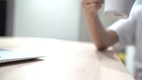 Close up of picking up a mug Stock Footage 292761136