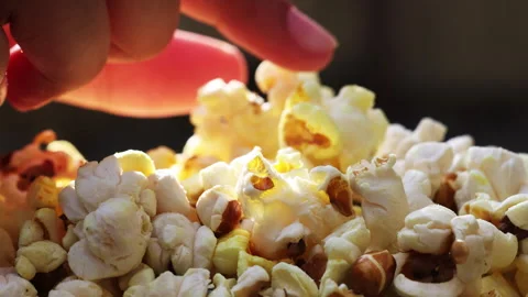 Close up of picking tasty popcorn Stock Footage 303327561