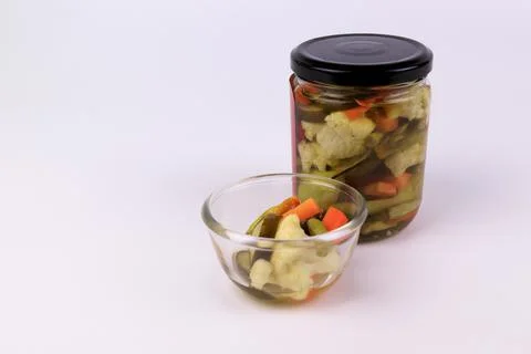 Close up Pickle in a bottle on white background Stock Photos