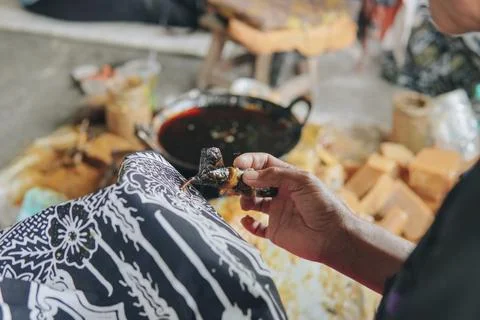 Close up picture of drawing the design pattern of Indonesian batik tulis fa.. Stock Photos