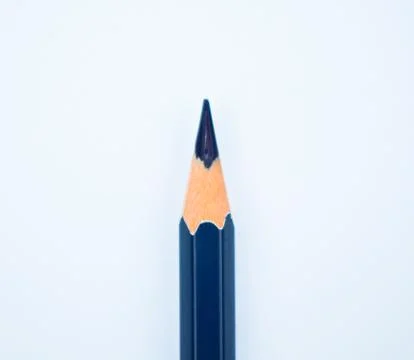 Close up picture of a nicely sharpened blue colored wood pencil crayon Stock Photos
