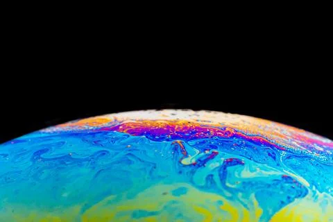 Close up picture of soap bubble with psychedelic color in half circle shape on a Foto stock