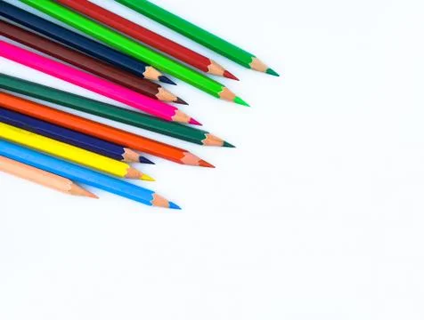 Close up picture of stack of different colored wood pencil crayon on a white Stock Photos