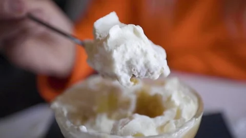 A close up of a piece of cake and ice cream on a plate Stock Footage 155461940