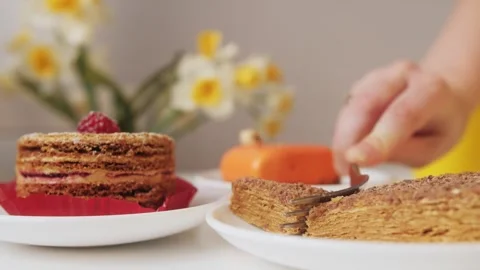 Close-up of a piece of cake. A fork separates a slice from the pie. Stock Footage 273024740