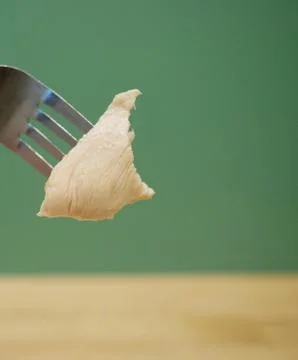 Close up piece of chicken on fork Stock Photos