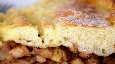Close up of piece of cinnamon apple pie sprinkle powdered sugar on top. 스톡 동영상 236476603