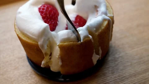 Close-up of a Piece of Strawberry Chiffon Cake Being Taken with a Fork Stock Footage 331775462