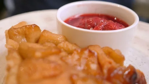 Close-up of a piece of vegan apple pie with fresh strawberry sauce Stock Footage 155258449