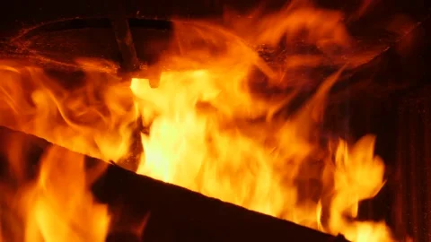 Close up piece of wood burning in flames. Slow motion 4K 库存影片 219611145