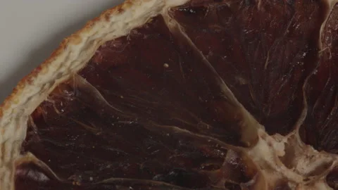 Close-up pieces of dried oranges. Dried sliced oranges rotating Stock Footage 203804034