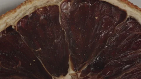 Close-up pieces of dried oranges. Dried sliced oranges rotating Stock Footage 203804101