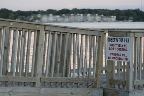 Close Up of Pier with Condos in Background Stock Photos