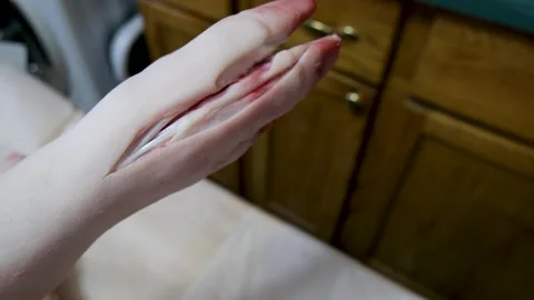 Close up of pig foot as camera move showing hog split in half exposing spine 库存影片 255434276