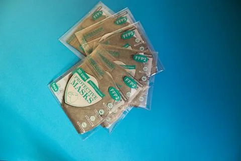 Close up of pile certified protective face ffp2 masks of grey color with thei Foto stock
