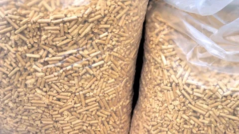 Close up pile of compressed wood pellets on plastic industry for use as an .. Stock Footage 272786806