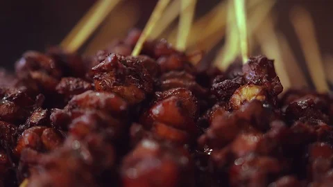 Close up on a pile of crispy roasted kebabs Stock Footage 115077042