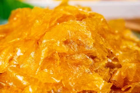 Close up Pile of dried mango sheet, thai street food market Stock Photos