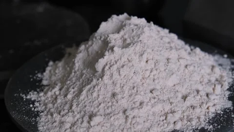 Close up of a pile of fresh white wheat flour on a plate 스톡 동영상 331987359