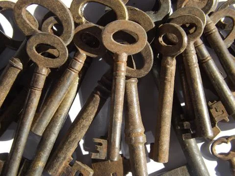 A close up of a pile of old fashioned rusty keys Stock Photos
