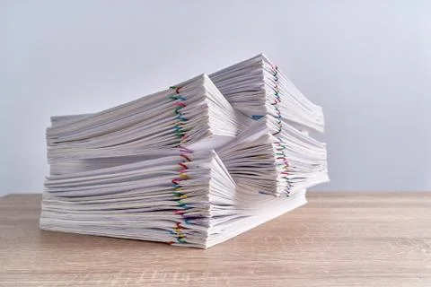 Close up pile overload paperwork report on wood table Stock Photos