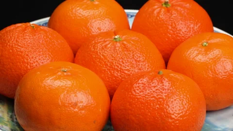 Close-up Pile of Ripe Oranges Rotating on Black Background Studio Shot 4K Stock Footage 319427089