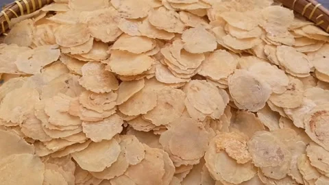 Close up of pile of thin crispy rice crackers stacked together, dry food Video stock 337760561