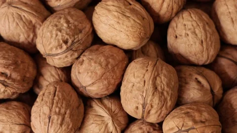 Close up of a pile of walnuts rotating Stock Footage 159604836