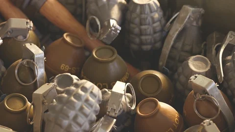 Close up of piled up different types of grenades in wooden ammunition box. 4k HD Stock Footage 119980033
