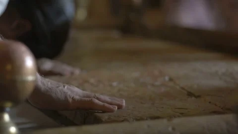 Close up of pilgrims hands at the Stone of Anointing in the Church of the Holy 스톡 동영상 70737968