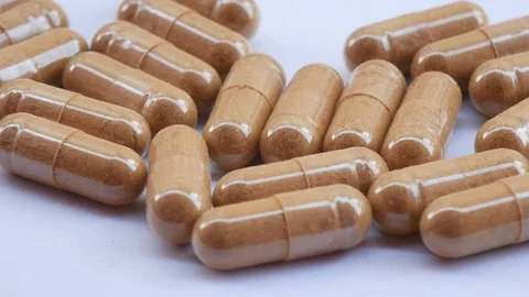 Close up pill on white. Video stock 129377204