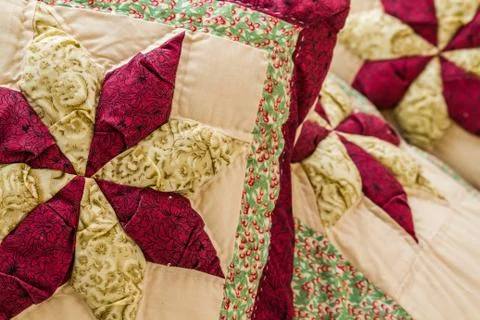 Close up of a pillow with colorful patchwork design Stock Photos