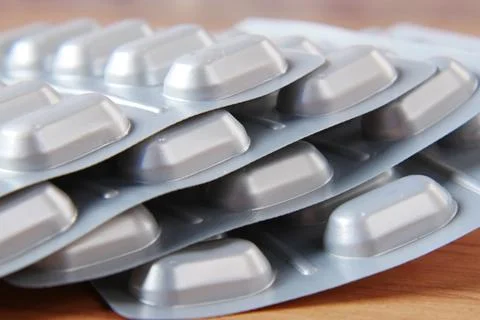 Close up of pills of blister pack on table Stock Photos